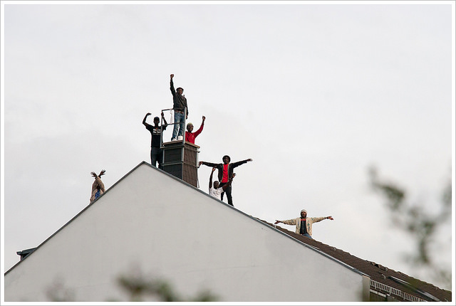 Refugees protesting on a room in Berlin (Credit: Montecruz Foto, CC BY SA 2.0)