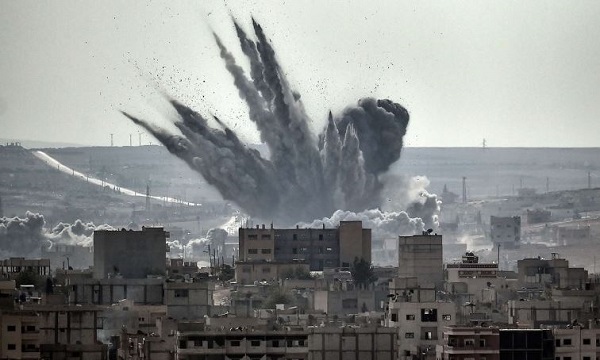 A shell explodes in the Syrian city of Kobane Credits: Aris Messinis/AFP/Getty Images. (CC BY 2.0)